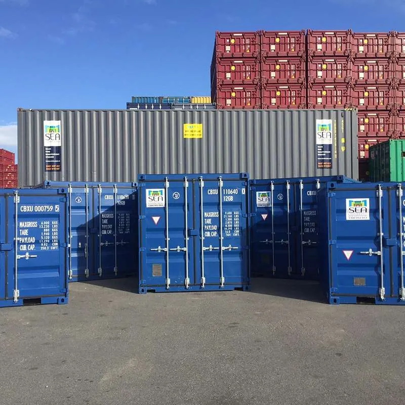 Stacked international shipping containers at a port